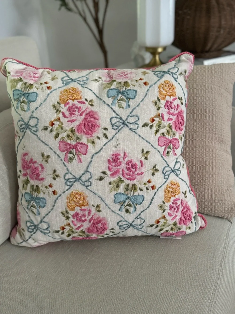 20” x 20” throw pillow features a trellis pattern with embroidered